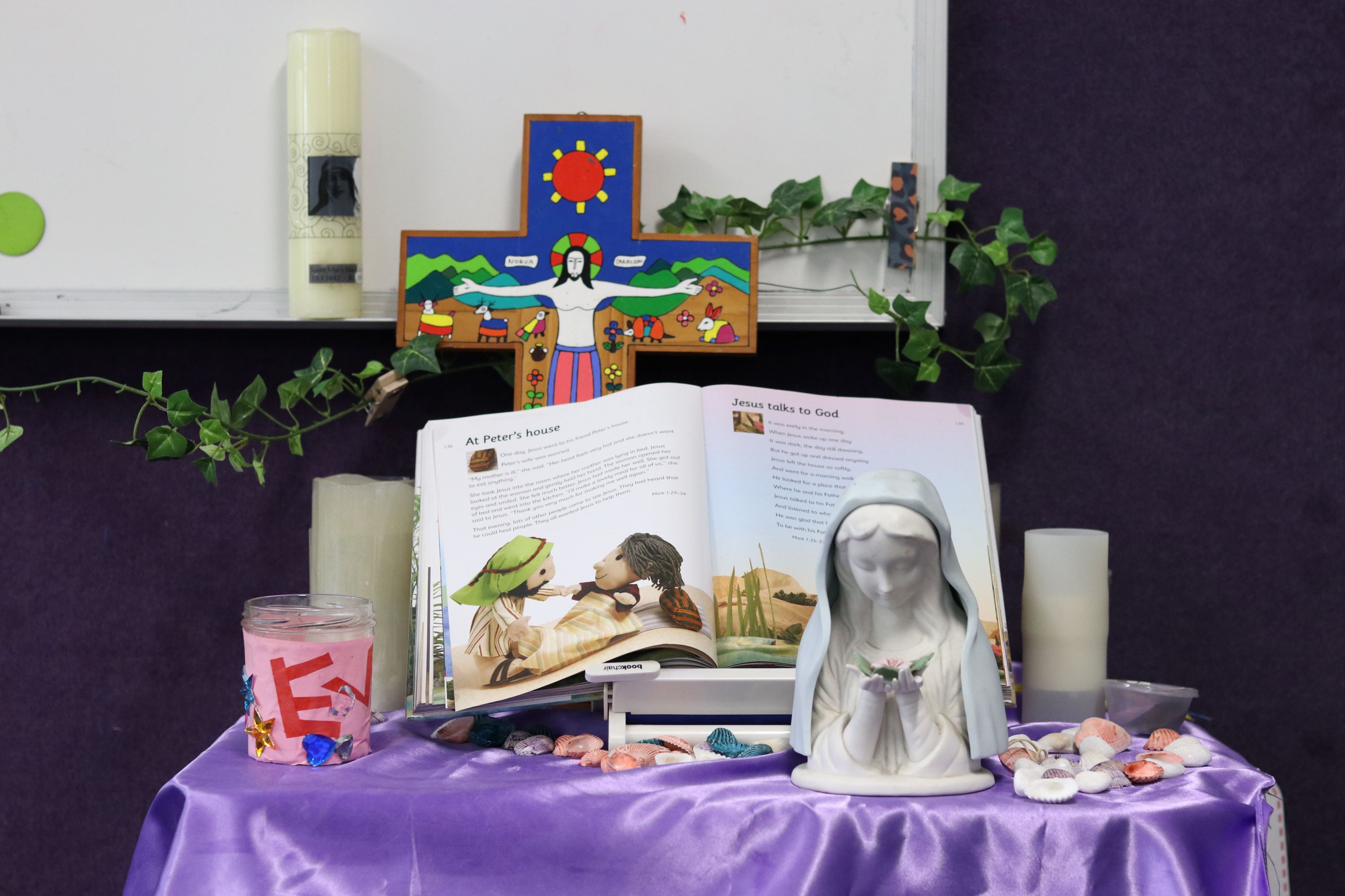 Prayer and reflection table displaying cross, scripture and Marian symbol, supporting faith formation, reflection and Catholic identity within the school community